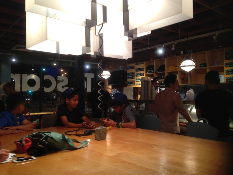 huge table in the middle of the shop where you could eat your ice cream while doing some work